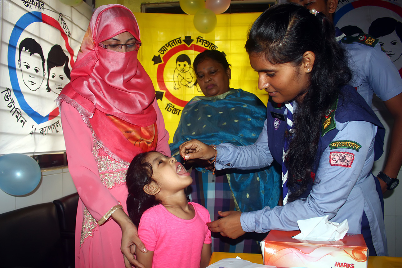 Children in Sylhet, Bangladesh receive vitamin A capsules at a temporary vaccination center. © 2018 HM Shahidul Islam / Shutterstock