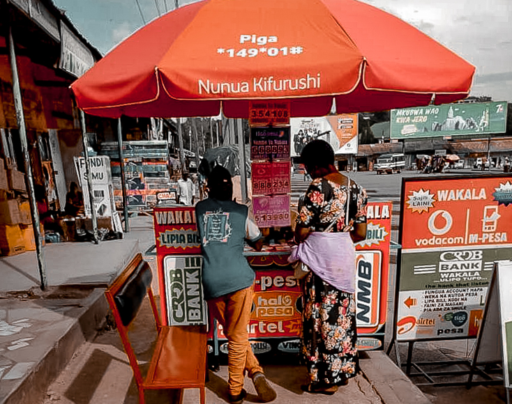 A woman at a mobile money vendor