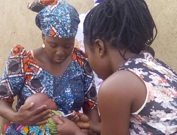 An infant is vaccinated in Ghana. © 2019 IPA Ghana
