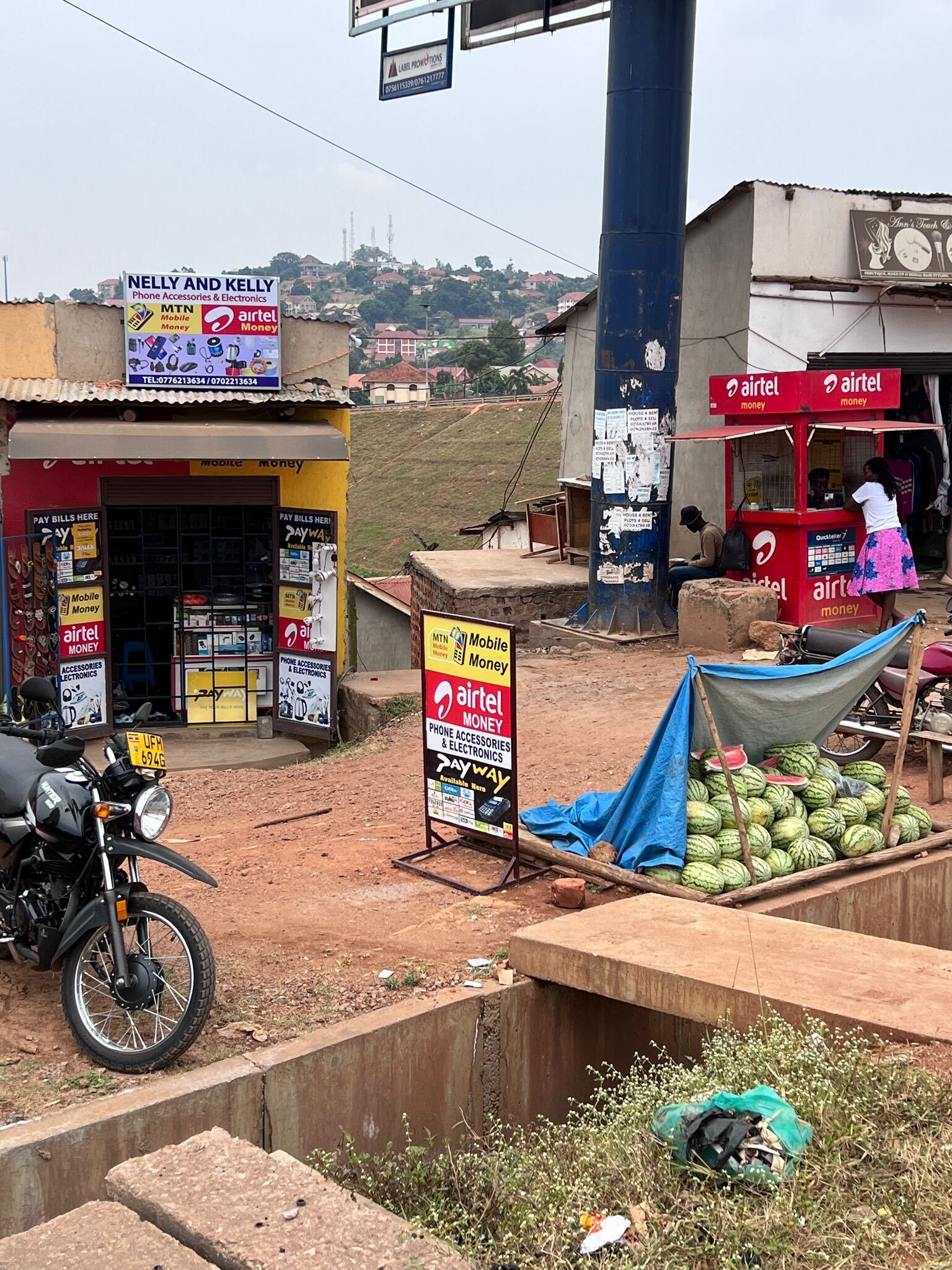 Photo of roadside mobile money vendors in Uganda