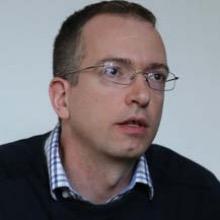 Adam Szeidl, professeur