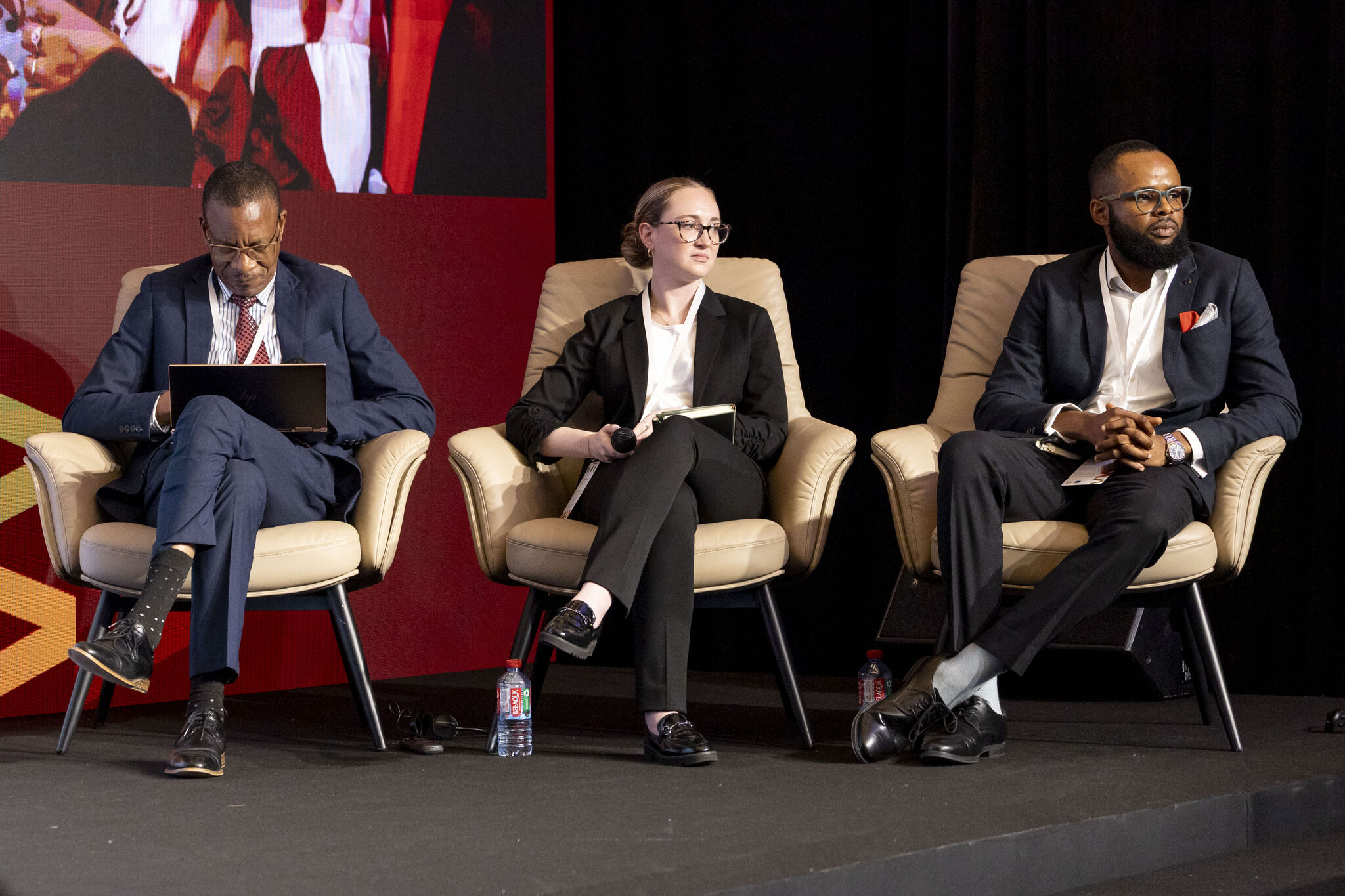 Lauren and Henry sitting onstage for the event panel