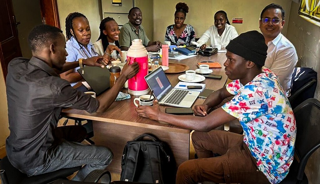 IPA Uganda team learning to use the POKET app. © 2024 IPA