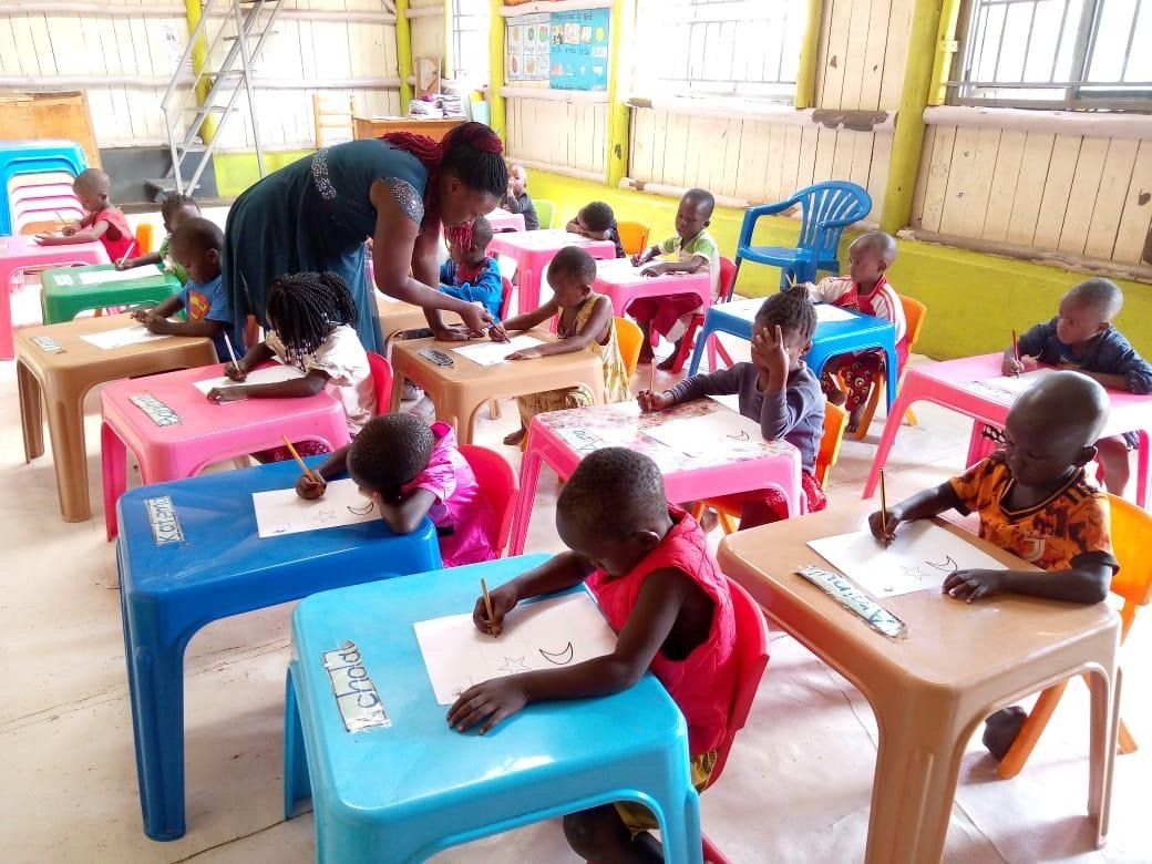 Young children participating in the BRAC time use study in a classroom
