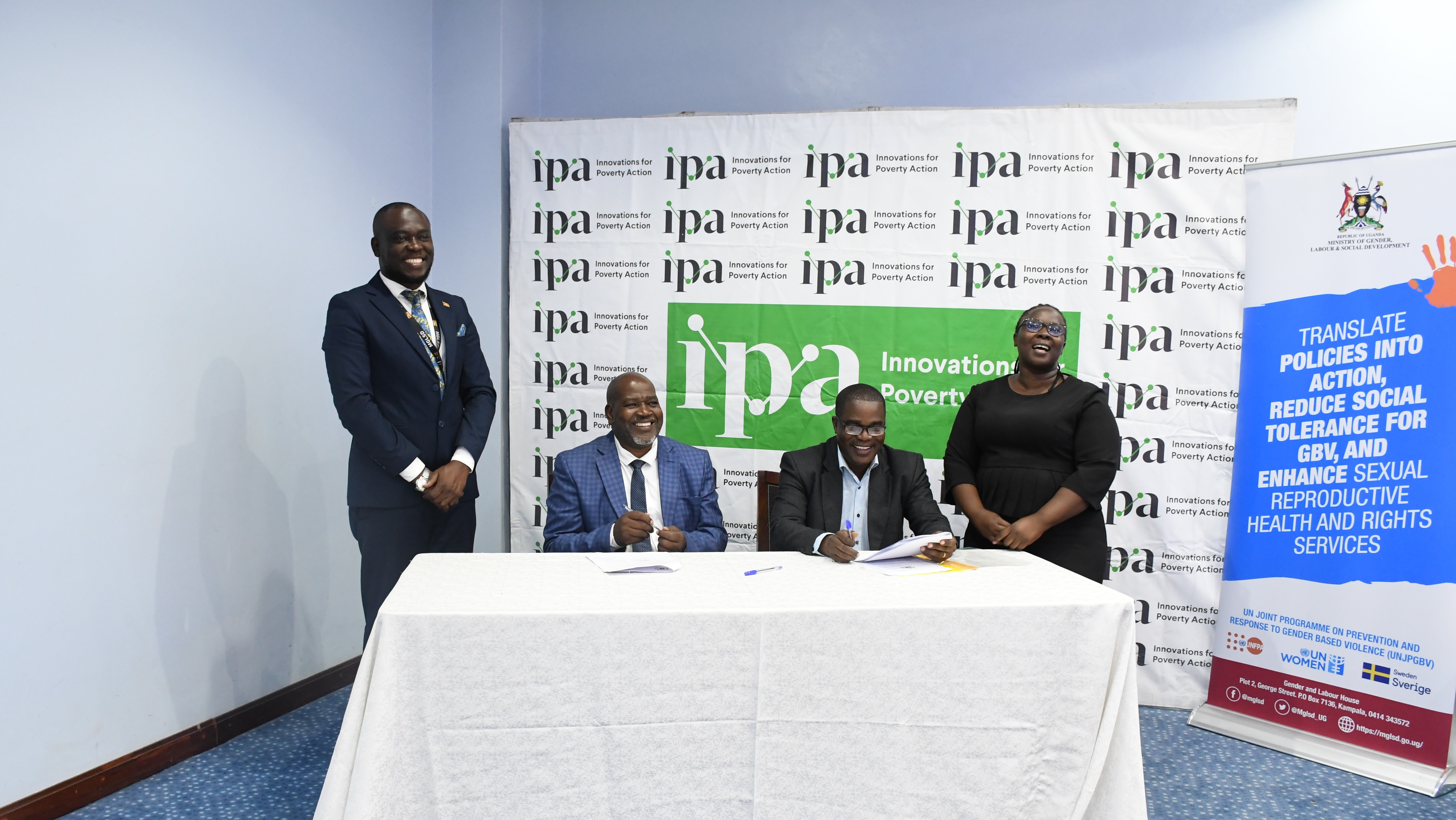 Representatives from IPA and the MoGLSD sign the MOU