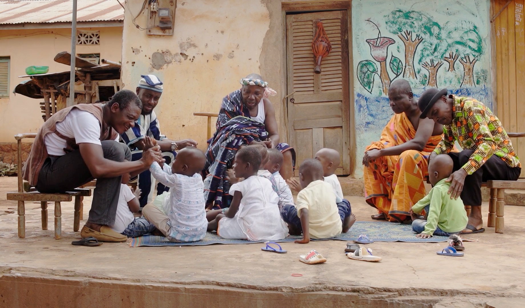 Male caregivers engage in responsive, nurturing care of young children in Côte d’Ivoire.