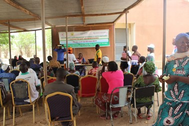 People assisting in a public lottery to find out which group they’ve been assigned to in the intervention, Burkina Faso