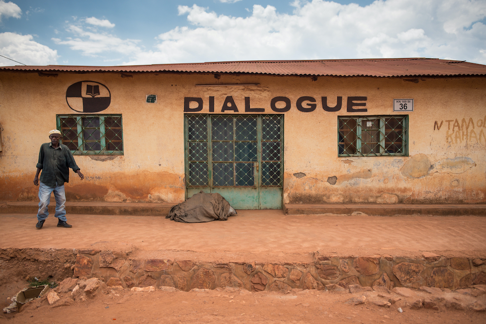 A man walking outside a space for community dialogue in Kigali, Rwanda. © 2016 Shutterstock / The Road Provides