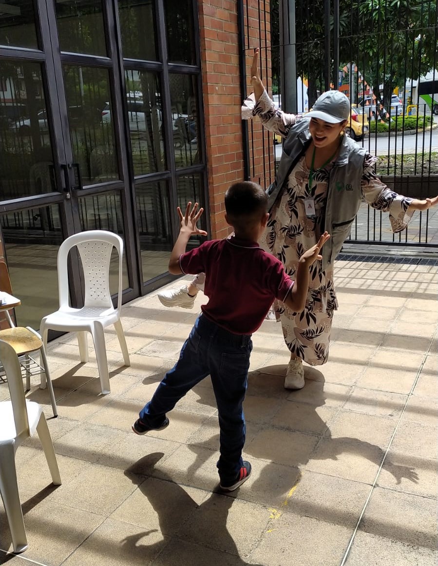 IPA enumerator playing with a child