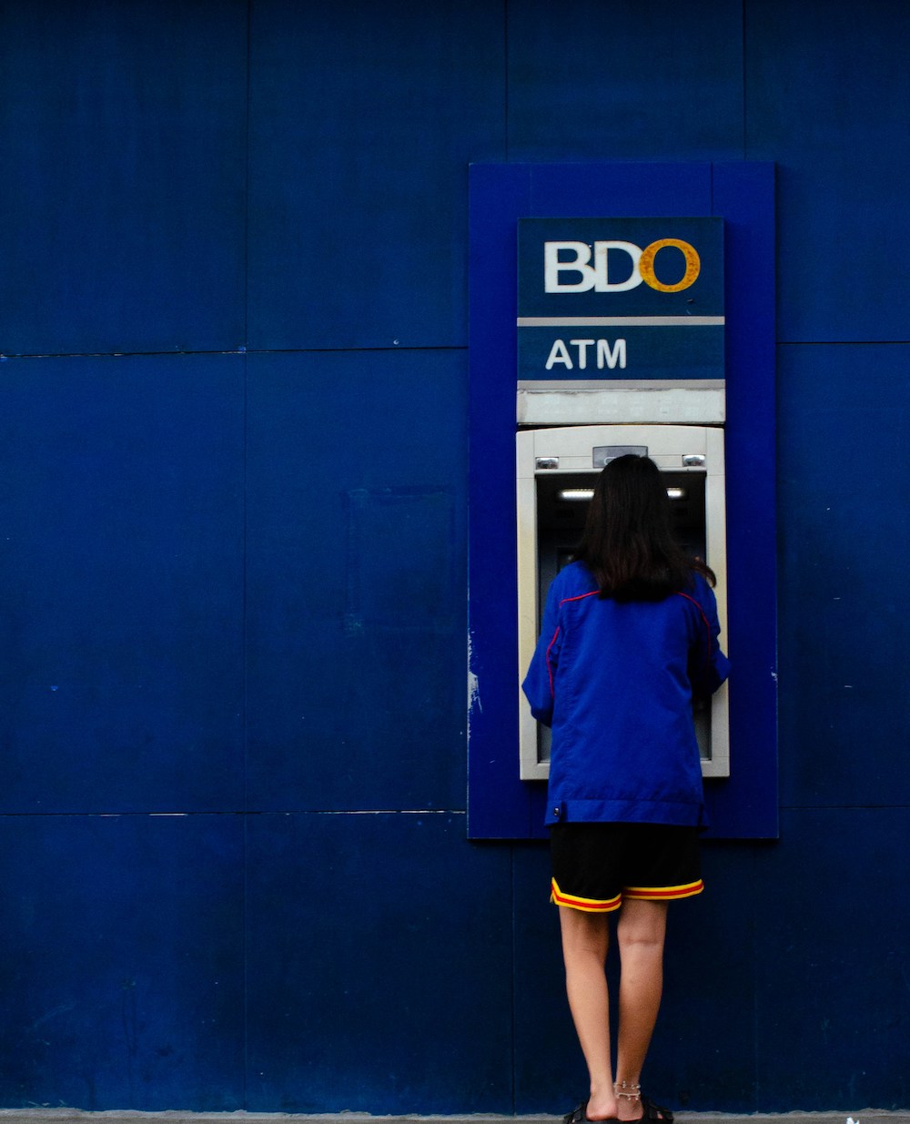 A woman at an ATM