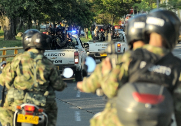 Military policing caravan in Cali