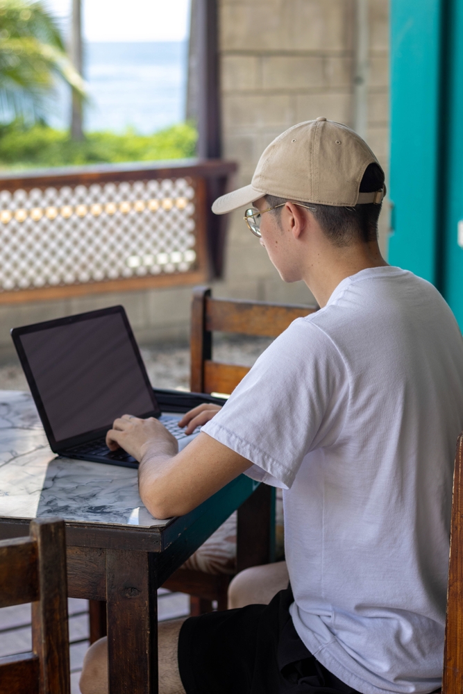 Young man on a laptop in Costa Rica