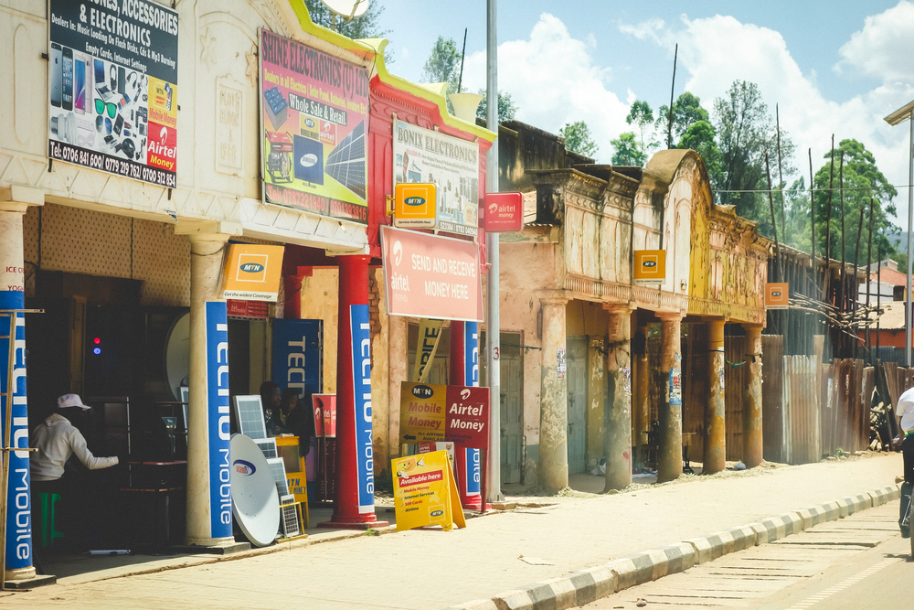 Storefronts advertising mobile money services in Kabale, Uganda. © 2017 Shutterstock/Stephanie Braconnier