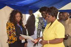 The First Lady Esther Lungu, FAWE Chairperson-Prof. Dranzoa and Minister of General Education Dr. Wanchinga and Nampaka Nkumbula presenting GN during the Exhibition