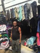 A used clothing trader and his stock in Lagos, Nigeria