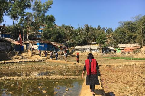 A photo of a woman with her back to the camera walking in Cox's Bazar, Bangladesh. © Jared Kalow