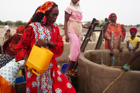 Local women drawing water from a well in the Sahel. © 2019 Pierre Laborde on Shutterstock