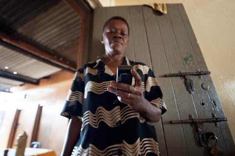 A woman with a cell phone in Uganda 