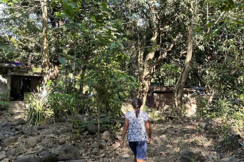 An ASA client living in a low-lying area by a river that draws closer to their home during heavy rains. 2023© Chrissie Cruz 