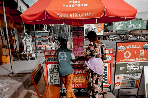 A woman at a mobile money vendor in Tanzania