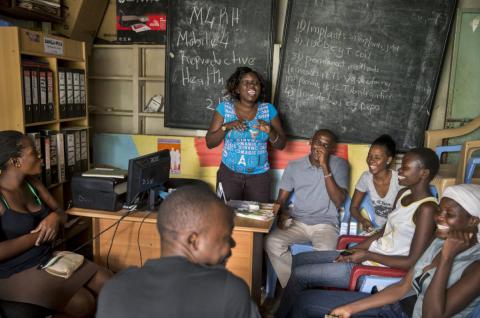 A group of men and women actively engaged during a community outreach on reproductive health (Photo: Jonathan Torgovnik/Getty Images/Images of Empowerment)