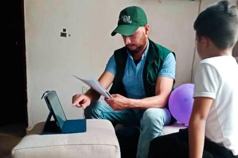 An IPA enumerator conducts a cognitive abilities assessment for a student in Bogotá, Colombia. © IPA 2023 / Lina Junguito