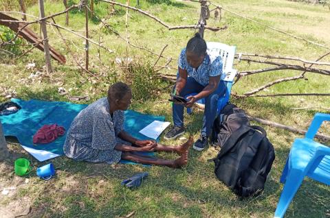 IPA enumerator with a female farmer