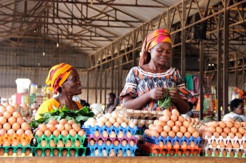 Rwandan women selling eggs to people visiting the Kimironko market in Rwanda’s capital city. © 2015 Sarine Arslanian/Shutterstock