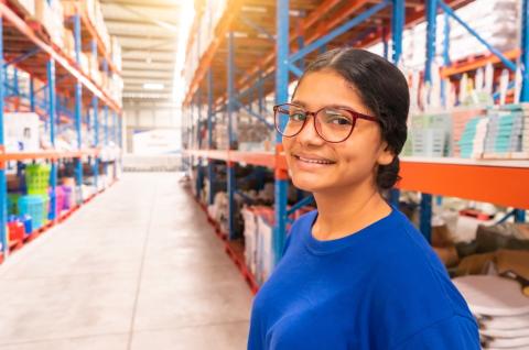 Young Latin American woman working in a super store in Central America.