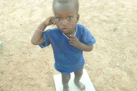 Child on balance, Burkina Faso