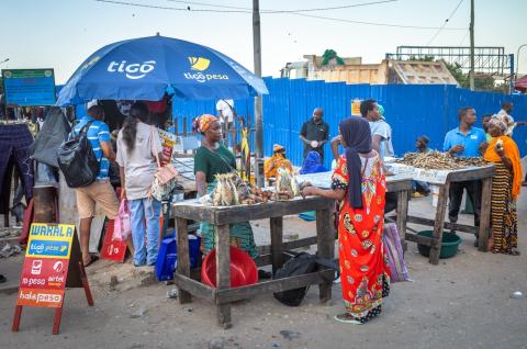 A mobile phone stand advertising digital banking options in Dar es Salaam Tanzania. © 2024 Shutterstock / Andy Soloman