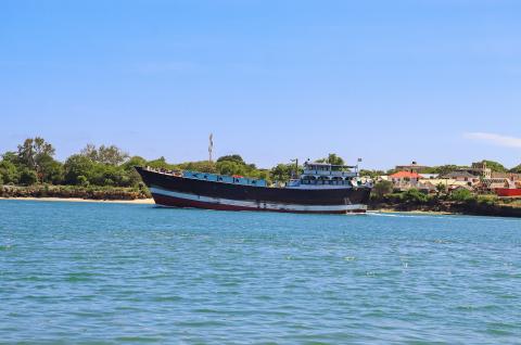 A boat sitting in the water in Mombasa, Kenya. This is not a confirmed instance of human trafficking. ©2023 Victor Birai on Unsplash