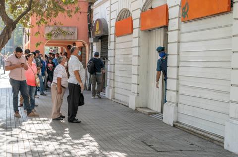 People waiting in Providencia streets to enter the banks, Santiago Chile