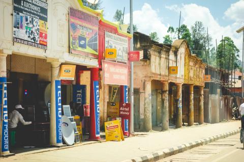 Storefronts advertising mobile money services in Kabale, Uganda. © 2017 Shutterstock/Stephanie Braconnier