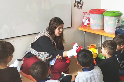 Bogota Colombia. Early childhood development worker playing with children. © Lina Junguito, 2023
