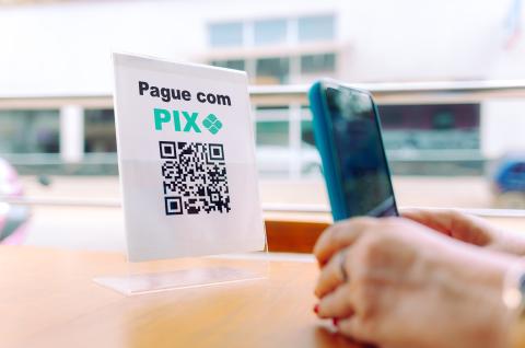 A customer paying using the service PIX in Brazil. © 2023, Marciobnws from Shutterstock