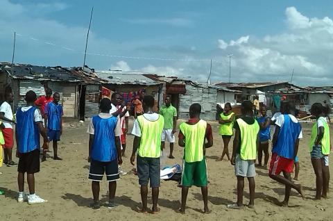 Photo of youth wearing sports uniforms. Credit: Chris Maclay/Mercy Corps