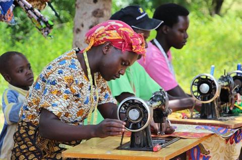 Photo of program participants using sewing machines
