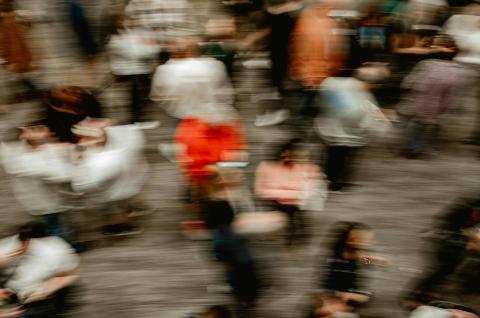 A blurry photo of a crowd of people. Credit: Bennie Bates via Unsplash