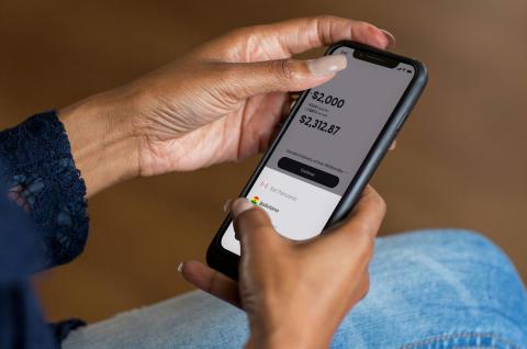 A person making digital transactions on a mobile phone