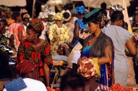 Women at a market in Senegal. © Jean Papillon on Unsplash