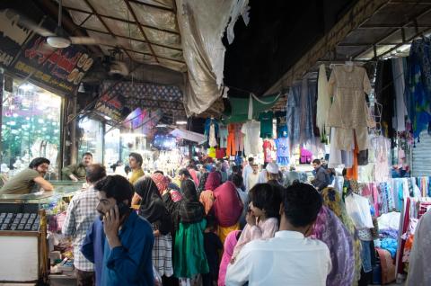 Merchants and consumers in a bazaar.
