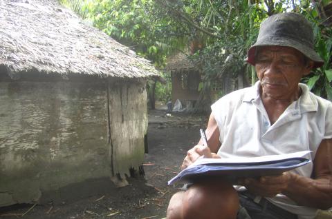 Farmer signing payout check
