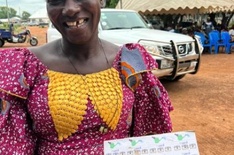 A CLASS program participant with a behaviorally-designed savings box, Northern Ghana, 2022. Credit: Christabel E. Dadzie / World Bank. 
