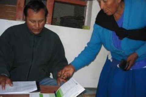 Person showing another person some paperwork
