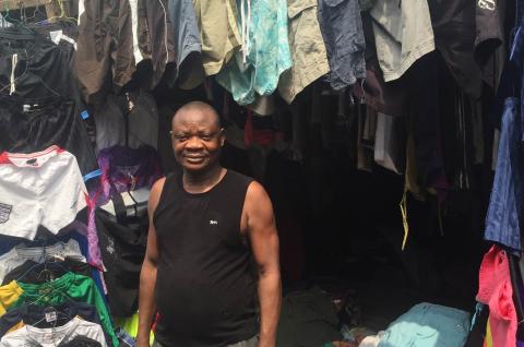 A used clothing trader and his stock in Lagos, Nigeria