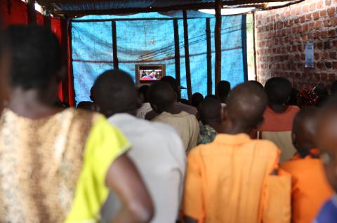 A mass video campaign broadcast on a television screen in Uganda. © 2018 IPA Uganda