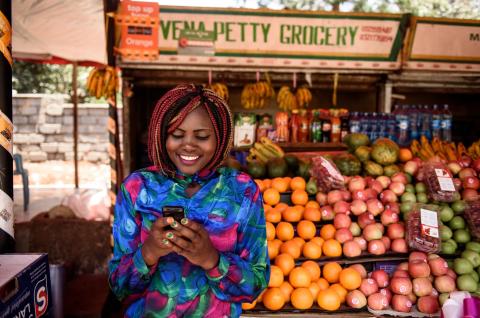 A photo of a mobile money user