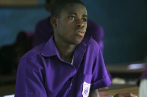 A Ghanaian student sits in class