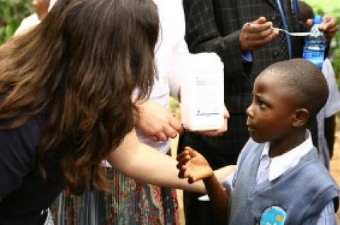 A child is given deworming medicine in Kenya
